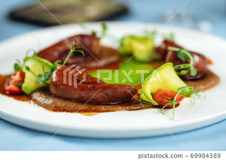 Lamb tongues with caramelized onion puree 69984389