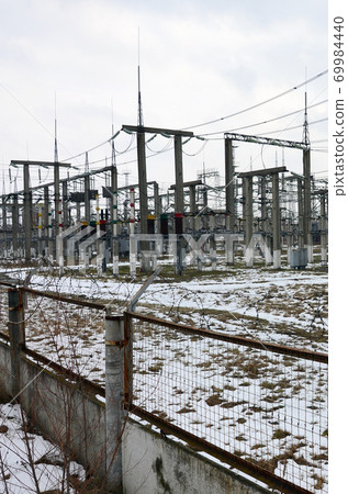 Power plant is a station of transformation. A lot of cables, poles and wires, transformers. Electro-energy. Power plant is a station of transformation. A lot of cables, poles and wires, transformers. Electro-energy. 69984440