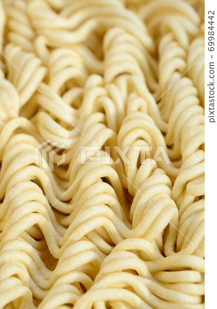 Close up view of yellow dry instant noodles. Chinese traditional food 69984442