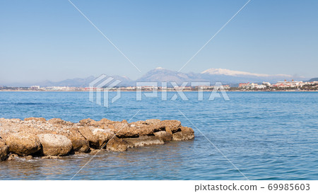 Side West Beach. The view towards the west beach of Side taken from the peninsula of the ancient Greek city of Side in southern Turkey. Side West Beach. The view towards the west beach of Side taken from the peninsula of the ancient Greek city of Side in southern Turkey. 69985603