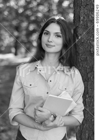 Young beautiful girl student in shirt. Black and white photo. BW 69986249