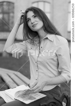 Young beautiful girl student in shirt. Black and white photo. BW 69986250