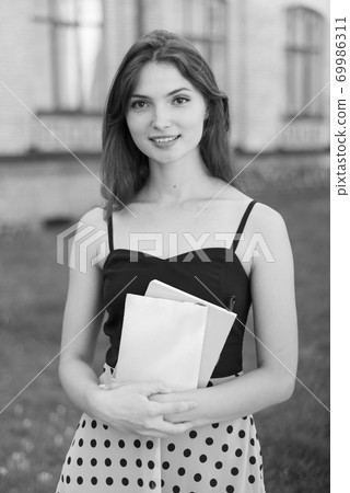 Young girl student in dress. Black and white photo. BW Young girl student in dress. Black and white photo. BW 69986311