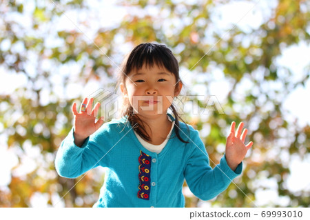 Girls playing in the park Girls playing in the park 69993010