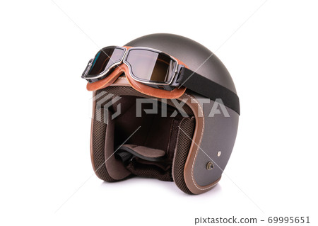 Close up new grey vintage helmet and wind goggle. Studio shot isolated on white Close up new grey vintage helmet and wind goggle. Studio shot isolated on white 69995651