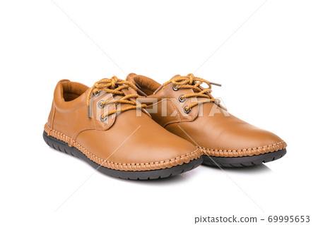New brown men leather shoes. Studio shot isolated on white New brown men leather shoes. Studio shot isolated on white 69995653