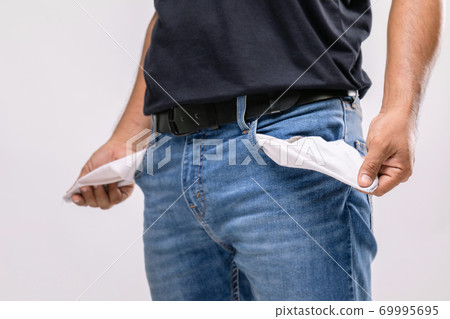No money in pants pocket. Close up man holding his empty pants pocket to show no money inside. Financial concept 69995695