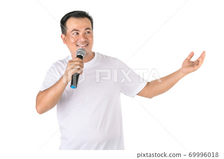 Portrait Asian man speaking to black wireless microphone with show hand gesture in studio Isolated on white 69996018