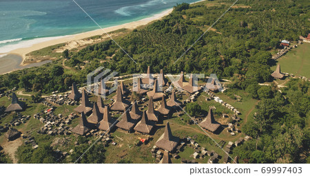 Top down of sea shore traditional village, tourist landmark. Aerial view of designed roofs houses 69997403