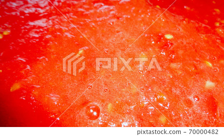 Red liquid organic tomato sauce in a white pot Red liquid organic tomato sauce in a white pot 70000482