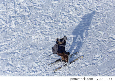 Man skiing in the snow in winter 70000953