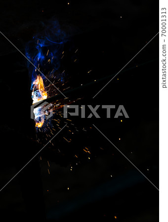 Flame of fire and sparks from welding metal at night Flame of fire and sparks from welding metal at night 70001313