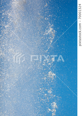 Splashes of water against the blue sky Splashes of water against the blue sky 70001324