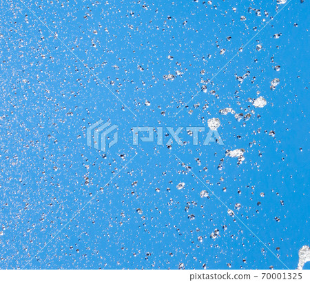 Splashes of water against the blue sky Splashes of water against the blue sky 70001325