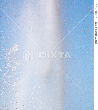 Splashes of water against the blue sky Splashes of water against the blue sky 70001327