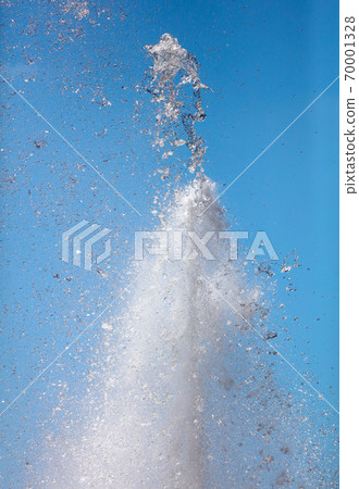 Splashes of water against the blue sky Splashes of water against the blue sky 70001328