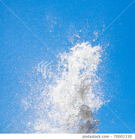 Splashes of water against the blue sky Splashes of water against the blue sky 70001330