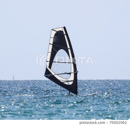 Surfing in the wind at sea. Surfing in the wind at sea. 70002062