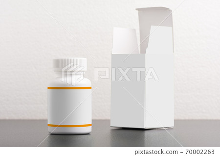 Pillbox dietary supplement bottle with package on background moc 70002263