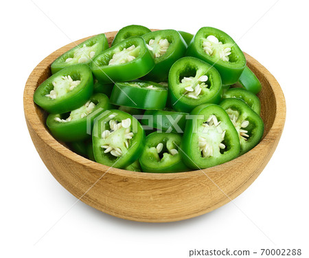 sliced jalapeno pepper in wooden bowl isolated on white background. Green chili pepper with clipping path and full depth of field. 70002288