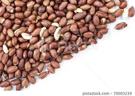 Peanuts on a white background. Top view. Peanuts on a white background. Top view. 70003239