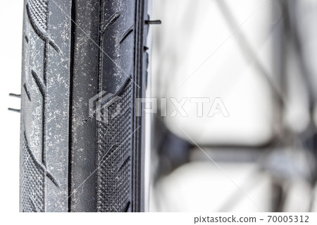 Close-up view and tread pattern of the bicycle. Detail of tire from road bike. 70005312