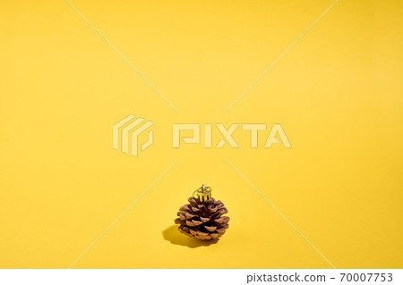 Pine cone craft as tree bauble. Christmas gift on a budget. Sustainable eco plastic free lifestyle Pine cone craft as tree bauble. Christmas gift on a budget. Sustainable eco plastic free lifestyle 70007753