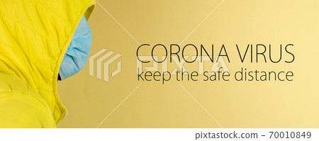 man in yellow jacket is using a protective mask against corona virus on yellow background man in yellow jacket is using a protective mask against corona virus on yellow background 70010849