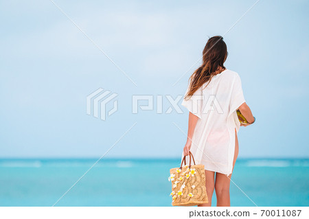 Young beautiful woman on beach vacation on Caribs Young beautiful woman on beach vacation on Caribs 70011087