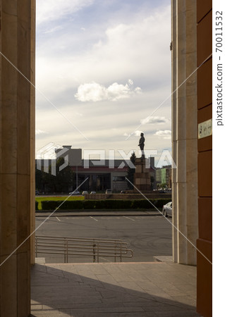Authentic soviet statue from behind columns of theater, vertical image Authentic soviet statue from behind columns of theater, vertical image 70011532