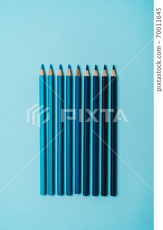 book, pencil, ruler on a blue background. book, pencil, ruler on a blue background. 70011645