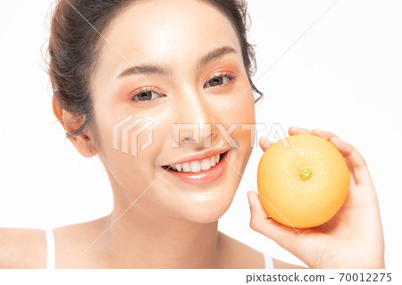 Beautiful Young Asian Woman Holding orange vitamin c smile feeling so happy and cheerful with healthy Clean and Fresh skin,isolated on white background,Beauty Cosmetics spa and treatment Concept Beautiful Young Asian Woman Holding orange vitamin c smile feeling so happy and cheerful with healthy Clean and Fresh skin,isolated on white background,Beauty Cosmetics spa and treatment Concept 70012275