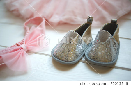 Outfit for a little girl: booties, bow and tulle skirt Outfit for a little girl: booties, bow and tulle skirt 70013546