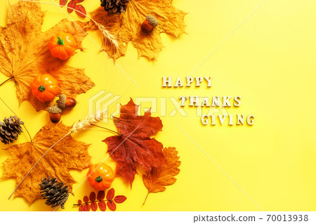 Colorful leaves and pumpkins on yellow frame with copy space. 70013938