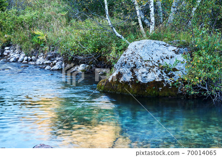 stream pool of a small mountain river with a beautiful rock on the bank stream pool of a small mountain river with a beautiful rock on the bank 70014065