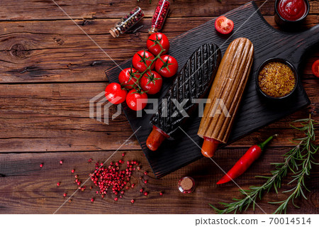 Delicious fresh hot hotdogs with various kinds of buns and sausages. 70014514