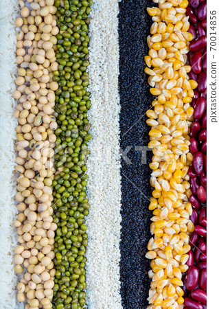 Cereal grains seeds beans on wooden background.  70014856