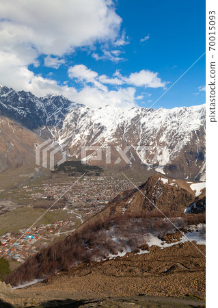 View of Stepantsminda at sunny spring day, Georgia 70015093