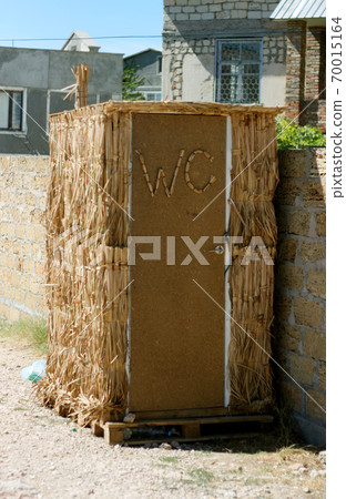 shelter made of straw changing room on the beach 70015164