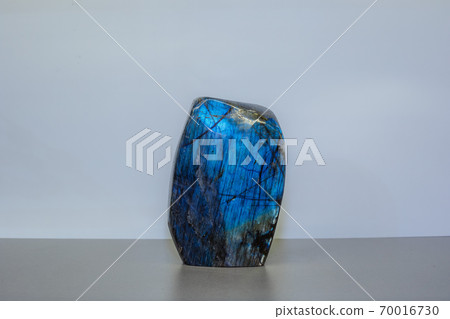 Amazing colorful Quartz Rainbow Flame Blue Aqua Aura crystal cluster closeup macro isolated on white background. Amazing colorful Quartz Rainbow Flame Blue Aqua Aura crystal cluster closeup macro isolated on white background. 70016730