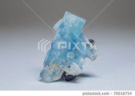 Amazing colorful Quartz Rainbow Flame Blue Aqua Aura crystal cluster closeup macro isolated on white background. Amazing colorful Quartz Rainbow Flame Blue Aqua Aura crystal cluster closeup macro isolated on white background. 70016754