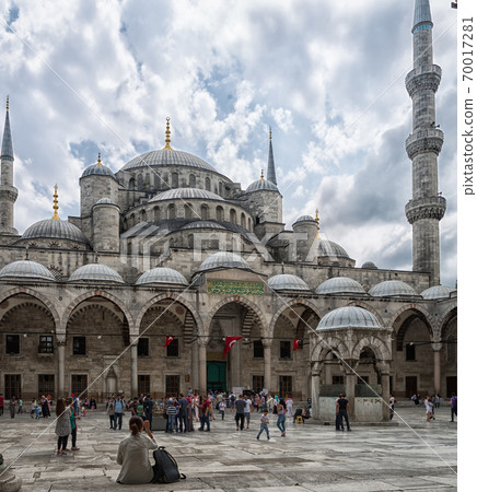 Sultan Ahmed Mosque (The blue Mosque) in Istanbul, Turkey daylight view from inner courtyard with clouds in sky in background Sultan Ahmed Mosque (The blue Mosque) in Istanbul, Turkey daylight view from inner courtyard with clouds in sky in background 70017281