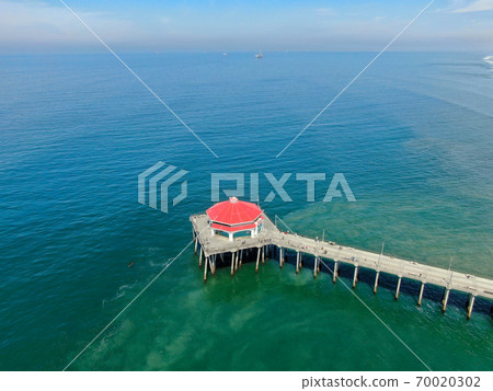 Aerial view of Huntington Pier, beach and coastline during sunny summer day 70020302