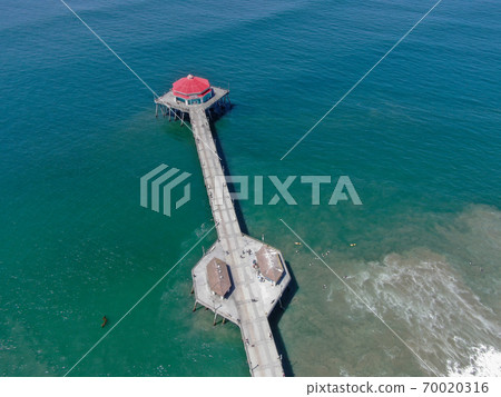 Aerial view of Huntington Pier, beach and coastline during sunny summer day 70020316
