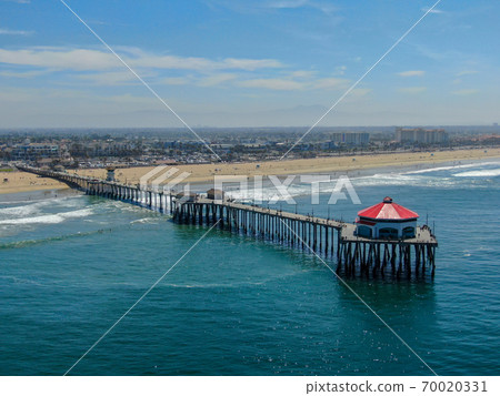 Aerial view of Huntington Pier, beach and coastline during sunny summer day 70020331