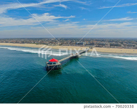 Aerial view of Huntington Pier, beach and coastline during sunny summer day 70020338