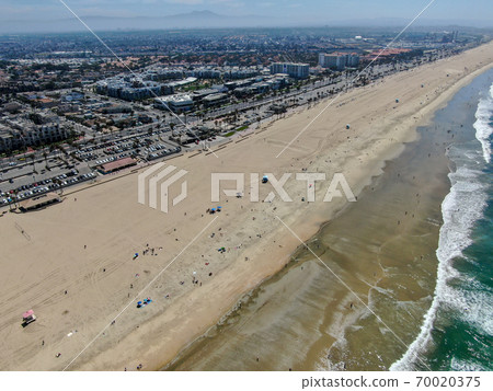 Aerial view of Huntington Beach and coastline during hot blue sunny summer day 70020375