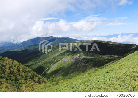 View of Northern Yatsugatake from the summit of Mt. Higashi Tengu, the Yatsugatake mountain range in early autumn View of Northern Yatsugatake from the summit of Mt. Higashi Tengu, the Yatsugatake mountain range in early autumn 70020709