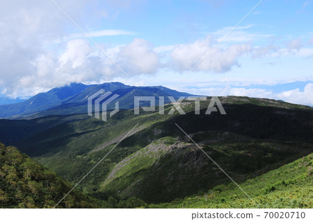 View of Northern Yatsugatake from the summit of Mt. Higashi Tengu, the Yatsugatake mountain range in early autumn View of Northern Yatsugatake from the summit of Mt. Higashi Tengu, the Yatsugatake mountain range in early autumn 70020710
