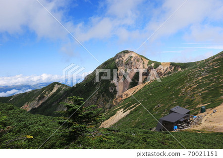 View of Mt. Nishitengu over Mt. Neishi from Mikamuriyama, the Yatsugatake mountain range in early autumn 70021151